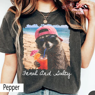 Feral And Salty Comfort Colors T-Shirt  Funny Beach Raccoon Shirt  Salty Summer Vacation Graphic Tee  Coastal Raccoon Meme Shirt NNA